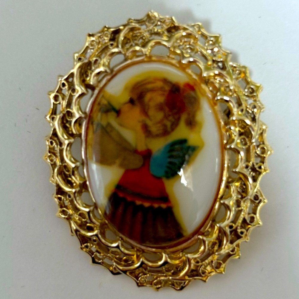 Artistic Gold Brooch with Angelic Design
